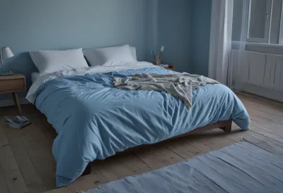 An unmade bed with the duvet thrown back in a bare, cold bedroom lit by blue pre-dawn light.