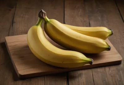 A whole ripe yellow banana resting on a plain wooden board.